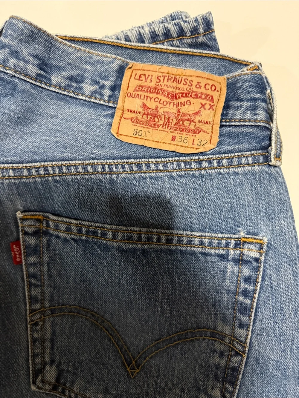 Levi's light blue denim jeans with tan leather patch